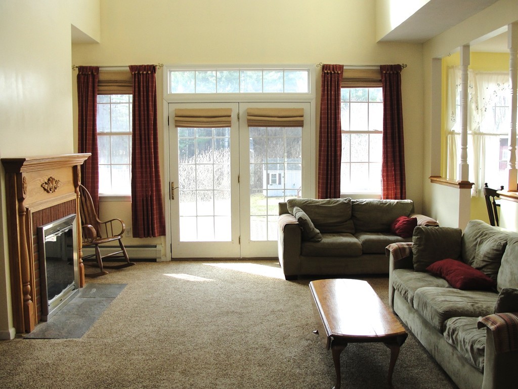 79 Valley Road Southampton, MA 01073 - Photo 17 of 30 a living room with furniture and a large window