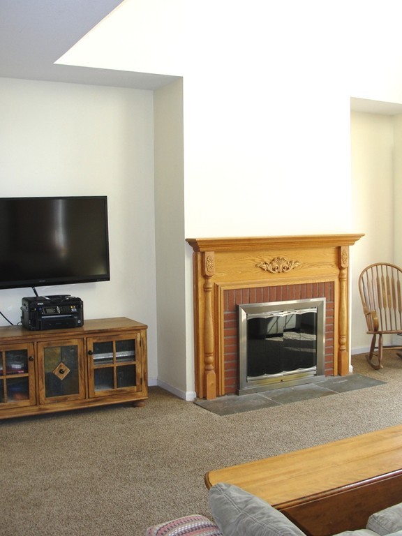 79 Valley Road Southampton, MA 01073 - Photo 18 of 30 a living room with furniture and a flat screen tv