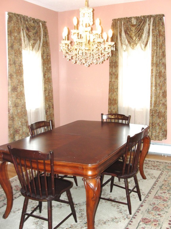 79 Valley Road Southampton, MA 01073 - Photo 19 of 30 a view of a dining room with furniture and chandelier