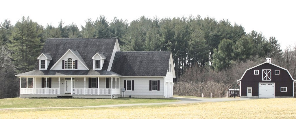 79 Valley Road Southampton, MA 01073 - Photo 2 of 30 a front view of a house with a yard and swimming pool
