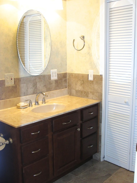 79 Valley Road Southampton, MA 01073 - Photo 29 of 30 a bathroom with a double vanity sink and a mirror