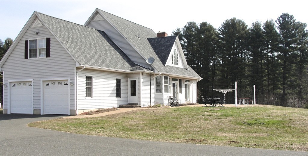 79 Valley Road Southampton, MA 01073 - Photo 5 of 30 a front view of a house with a yard
