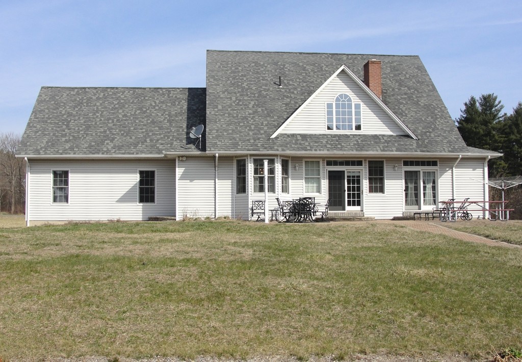 79 Valley Road Southampton, MA 01073 - Photo 6 of 30 a front view of a house with a garden and porch