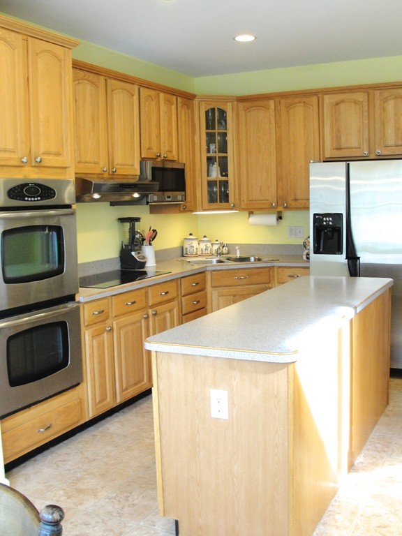 79 Valley Road Southampton, MA 01073 - Photo 10 of 30 a kitchen with stainless steel appliances a stove a sink a microwave and cabinets