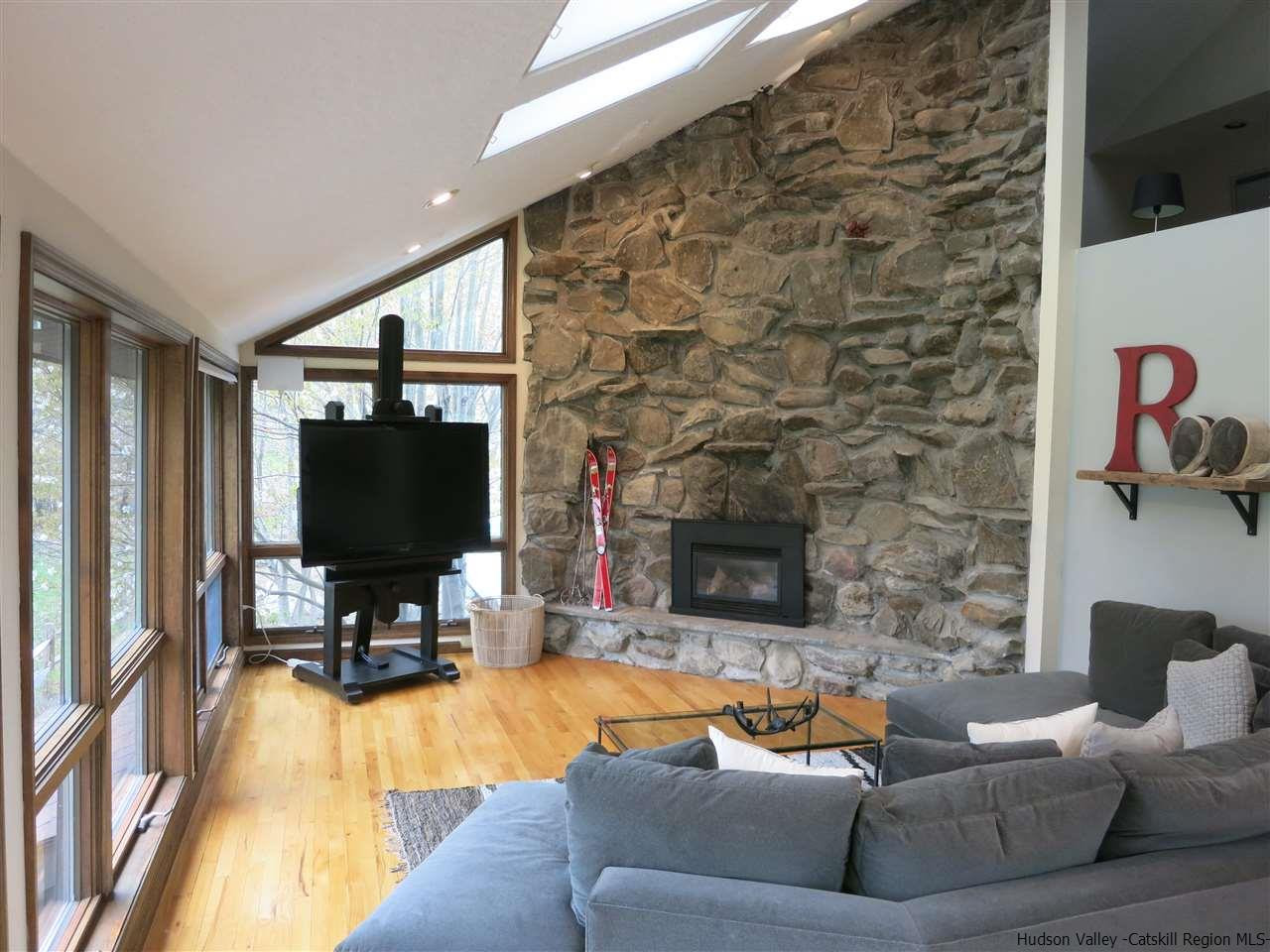 196 Sparkling Ridge Road New Paltz, NY 12561 - Photo 4 of 25 a living room with furniture and a flat screen tv