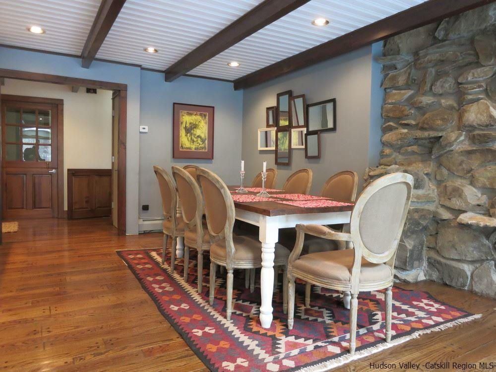 196 Sparkling Ridge Road New Paltz, NY 12561 - Photo 7 of 25 a dining room with furniture a rug and wooden floor