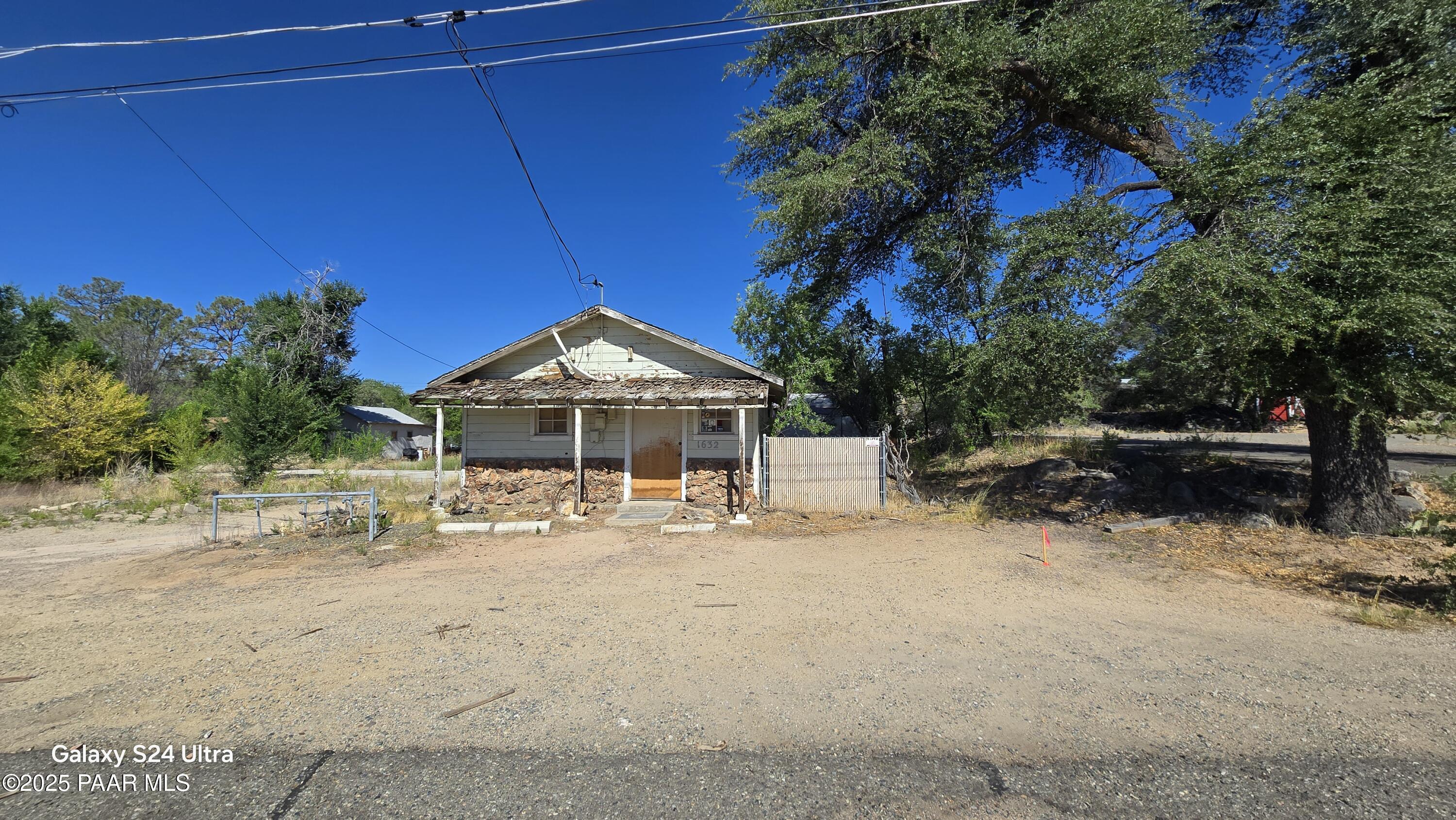 1628 Kile Street Prescott, AZ 86305 - Photo 8 of 11 a front view of a house with a yard