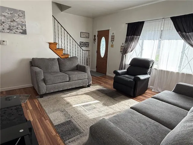 a living room with patio furniture and a window