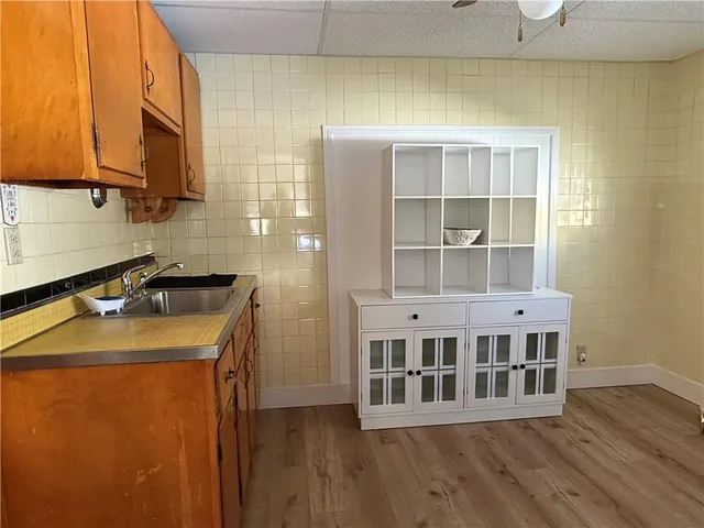 a kitchen with a stove and a refrigerator