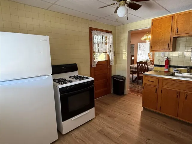 a kitchen with a stove and a refrigerator
