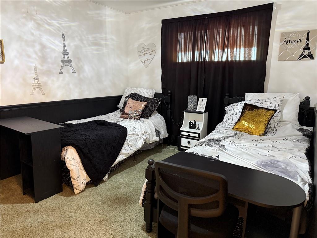 512 Watson Street Vandergrift, PA 15690 - Photo 25 of 35 a bed sitting in a bedroom next to a window