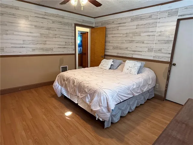 an empty room with wooden floor