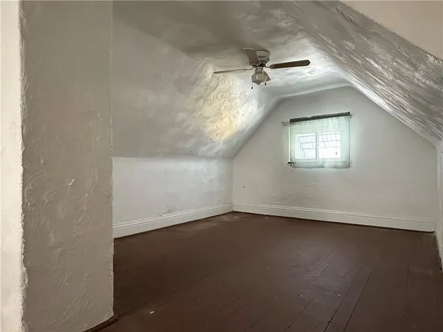a view of a hallway with windows