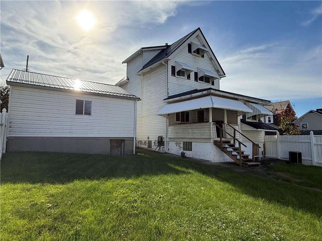 512 Watson Street Vandergrift, PA 15690 - Photo 4 of 35 a front view of a house with a yard