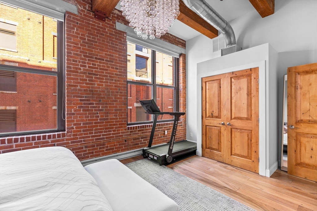 15 Sleeper Street, Unit 206 Boston, MA 02210 - Photo 15 of 21 a view of a brick house with wooden floor and windows