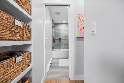 a bedroom with furniture and a window
