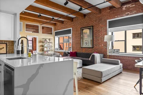 a living room with furniture and windows