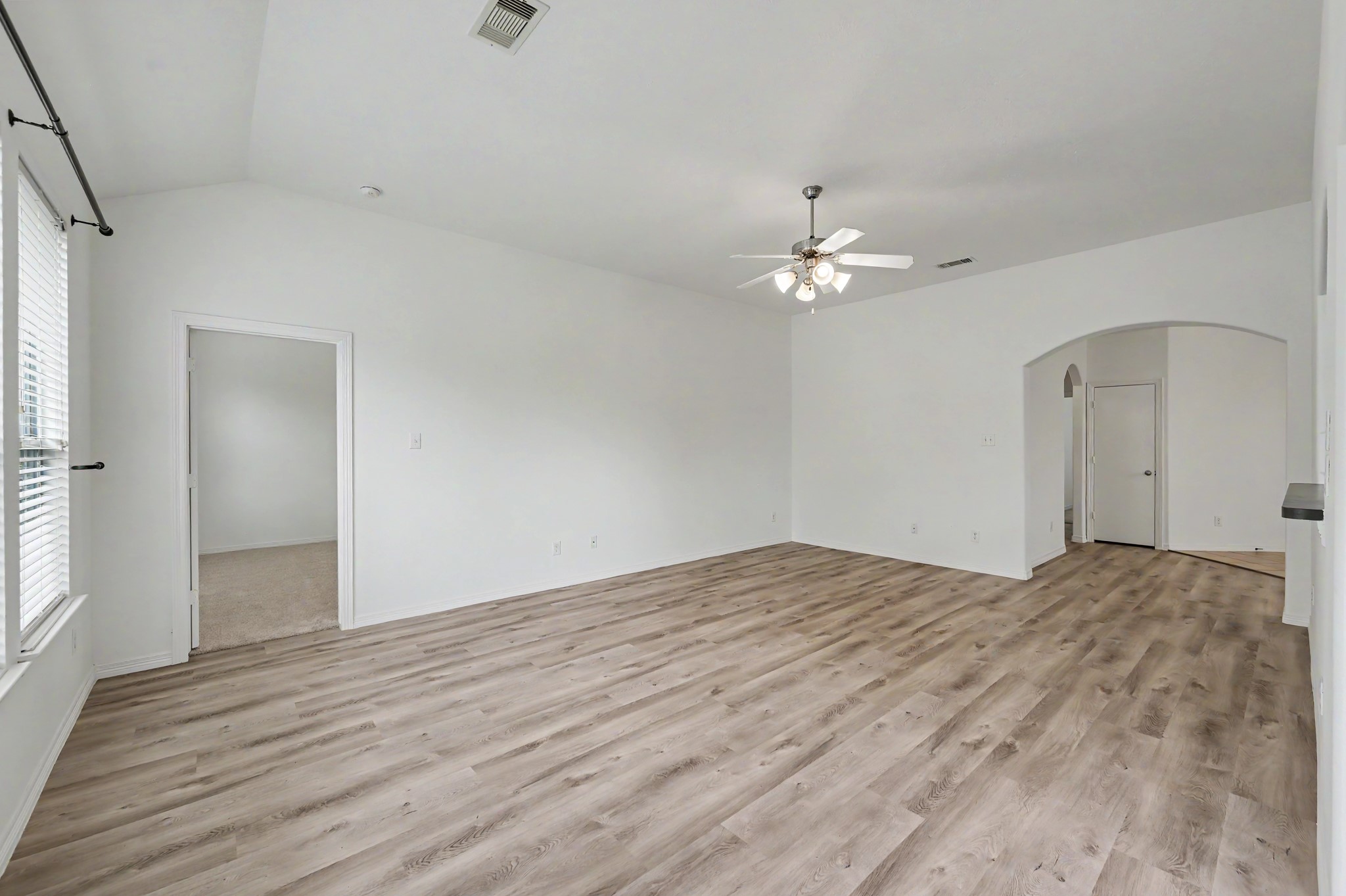 13035 Avery Ridge Lane Tomball, TX 77377 - Photo 8 of 27 Spacious living area with neutral walls. The entire interior was recently painted and the rich vinyl plank floors were just installed as well as brand new carpet in the bedrms.
