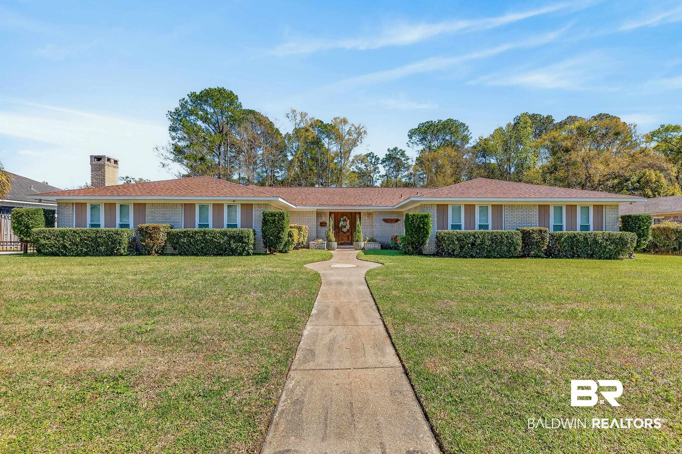 1271 Spring Valley Drive South Mobile, AL 36693 - Photo 1 of 56 Single story home featuring a front lawn, a chimney, and brick siding