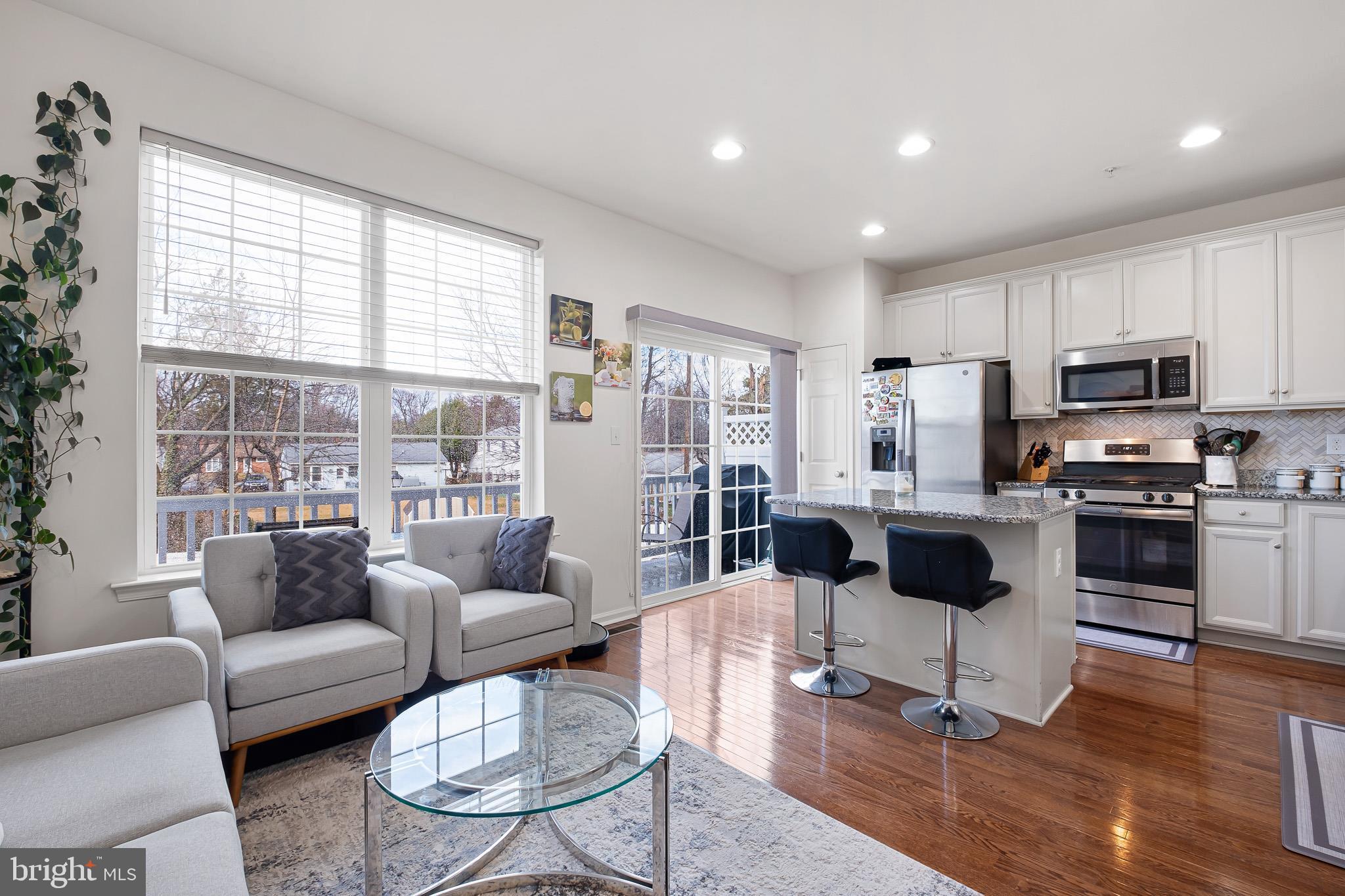 453 Lenape Way Claymont, DE 19703 - Photo 11 of 20 a living room with furniture and a view of kitchen