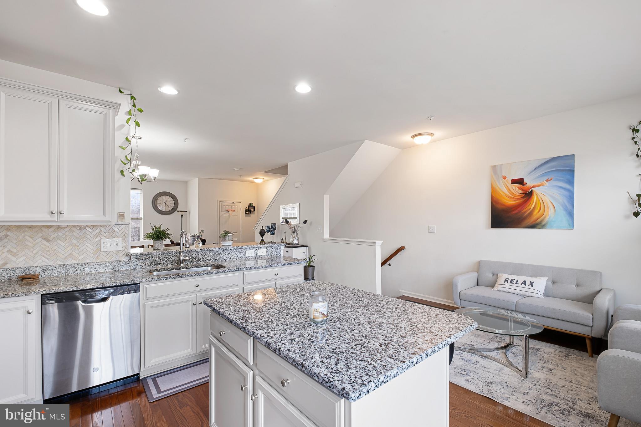 453 Lenape Way Claymont, DE 19703 - Photo 13 of 20 a kitchen with stainless steel appliances granite countertop a sink stove and cabinets