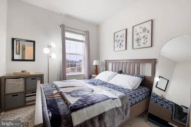 a bedroom with a bed and a table in it