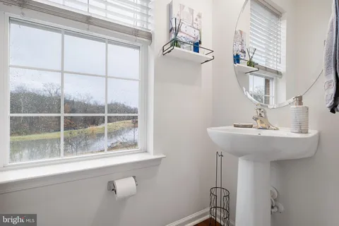 a bathroom with a sink and a window