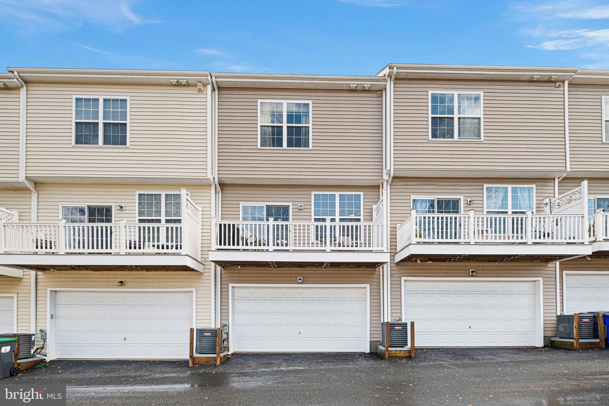 453 Lenape Way Claymont, DE 19703 - Photo 2 of 20 a front view of residential houses with parking