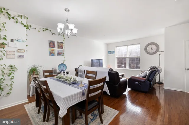 a view of a livingroom with furniture window and wooden floor