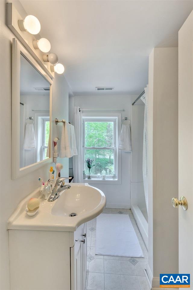 2908 Precinct Road Esmont, VA 22937 - Photo 13 of 23 a bathroom with a sink and a mirror