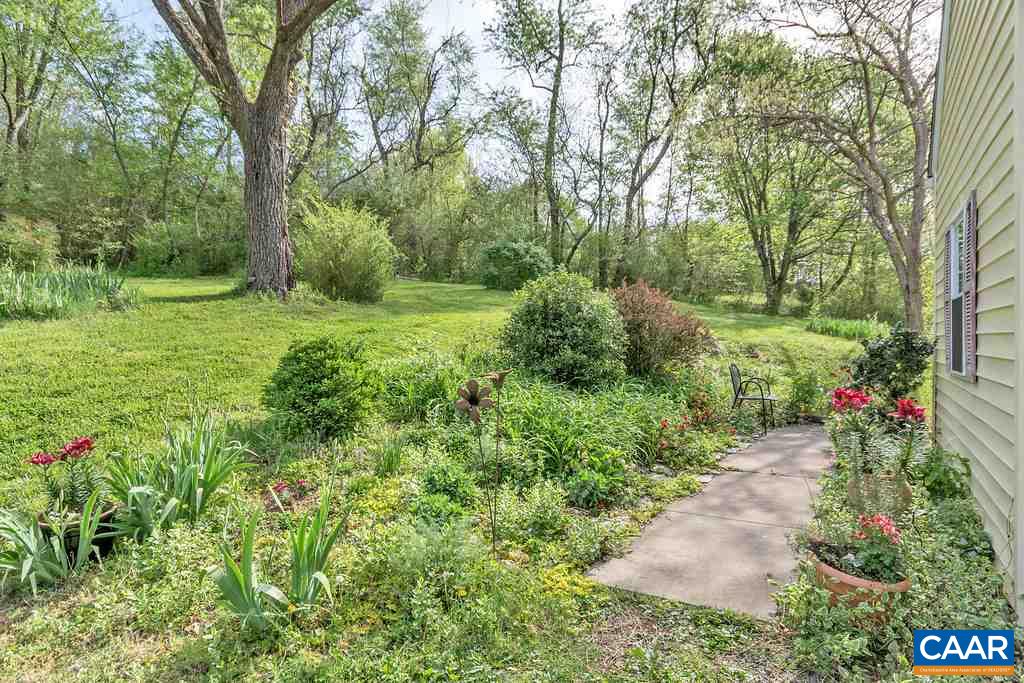 2908 Precinct Road Esmont, VA 22937 - Photo 16 of 23 a view of a garden with plants and trees