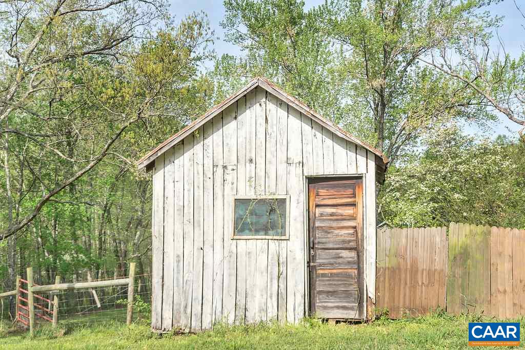 2908 Precinct Road Esmont, VA 22937 - Photo 21 of 23 a view of backyard with cabin and wooden fence