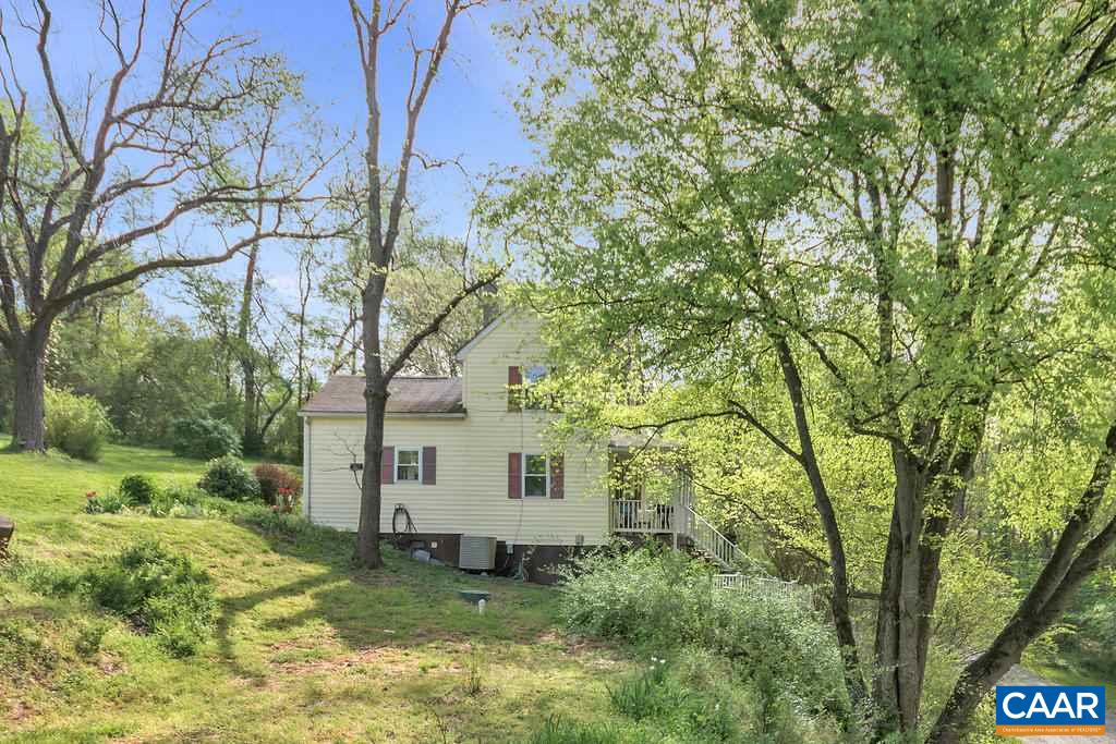 2908 Precinct Road Esmont, VA 22937 - Photo 22 of 23 a backyard of a house with lots of green space