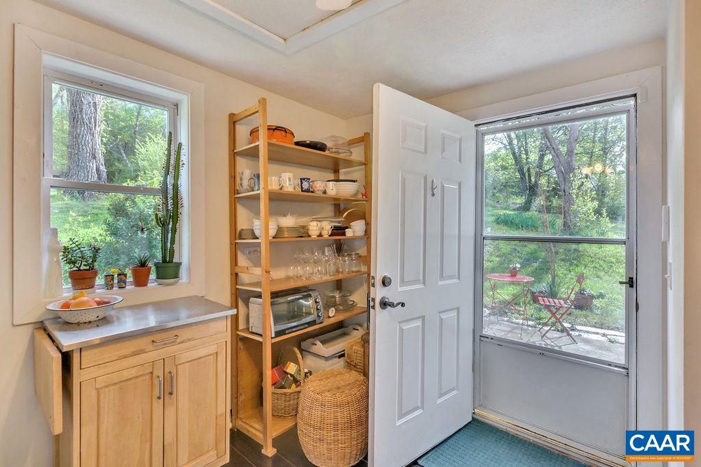 2908 Precinct Road Esmont, VA 22937 - Photo 6 of 23 a open kitchen with stainless steel appliances granite countertop a stove and a refrigerator