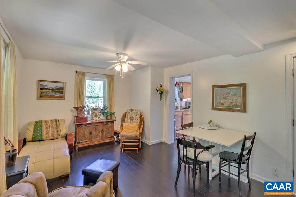2908 Precinct Road Esmont, VA 22937 - Photo 9 of 23 a living room with furniture and a dining table with wooden floor