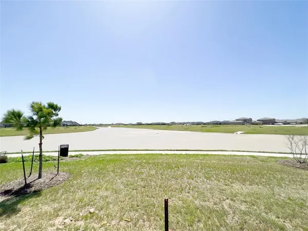 a view of a lake with a big yard
