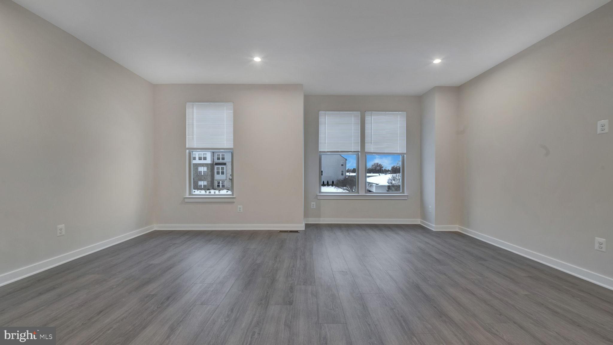 13170 Arches Road Herndon, VA 20170 - Photo 13 of 30 a view of wooden floor and windows in a room