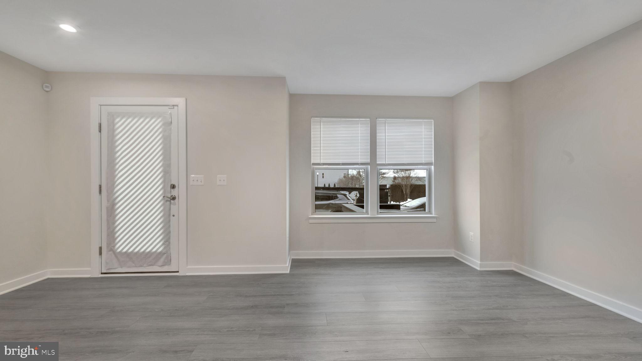 13170 Arches Road Herndon, VA 20170 - Photo 26 of 30 a view of a livingroom with wooden floor and a window