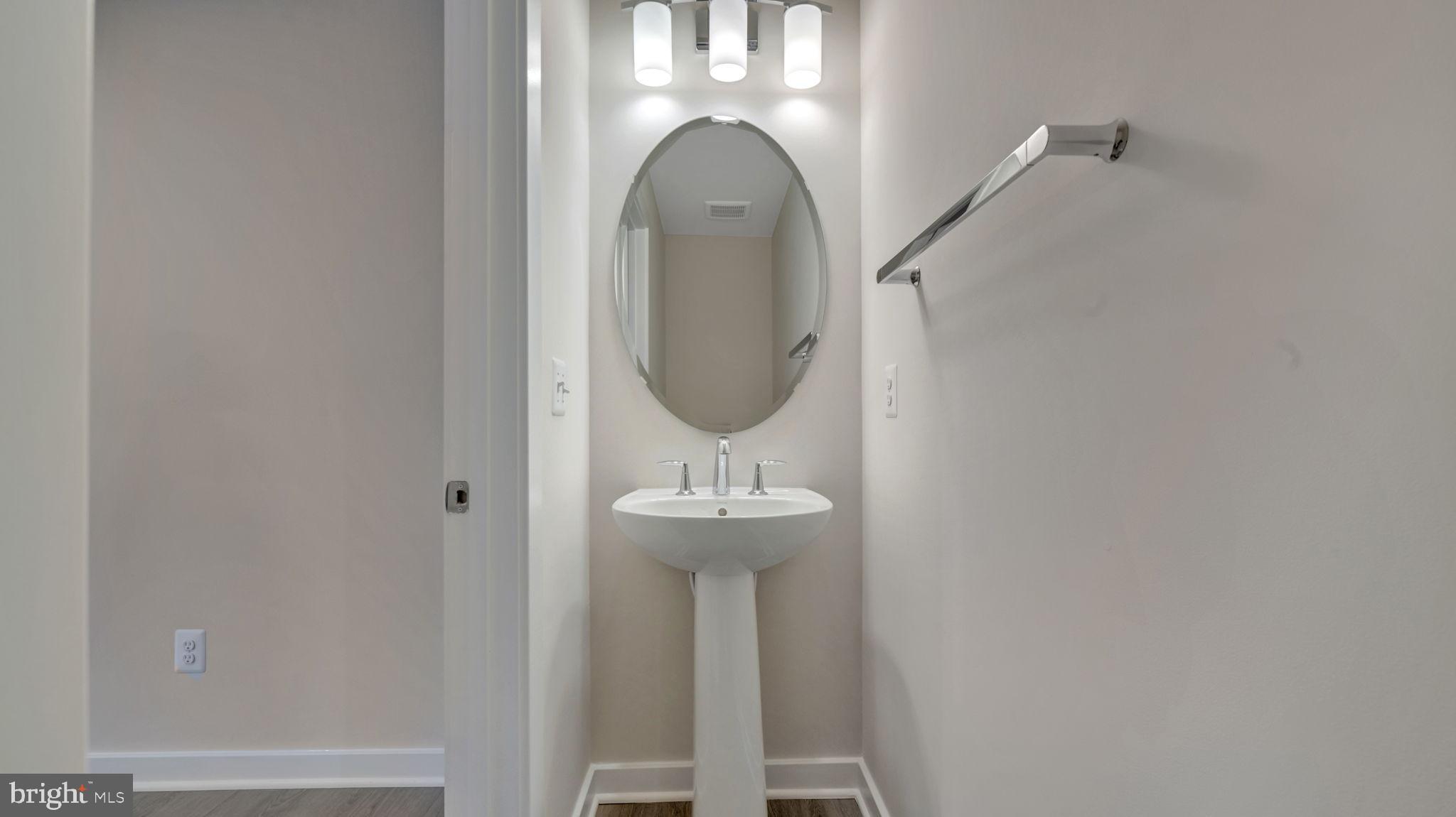 13170 Arches Road Herndon, VA 20170 - Photo 30 of 30 a bathroom with a sink and a mirror