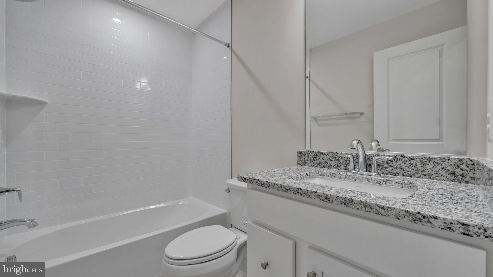 13170 Arches Road Herndon, VA 20170 - Photo 6 of 30 a bathroom with a granite countertop sink toilet and shower