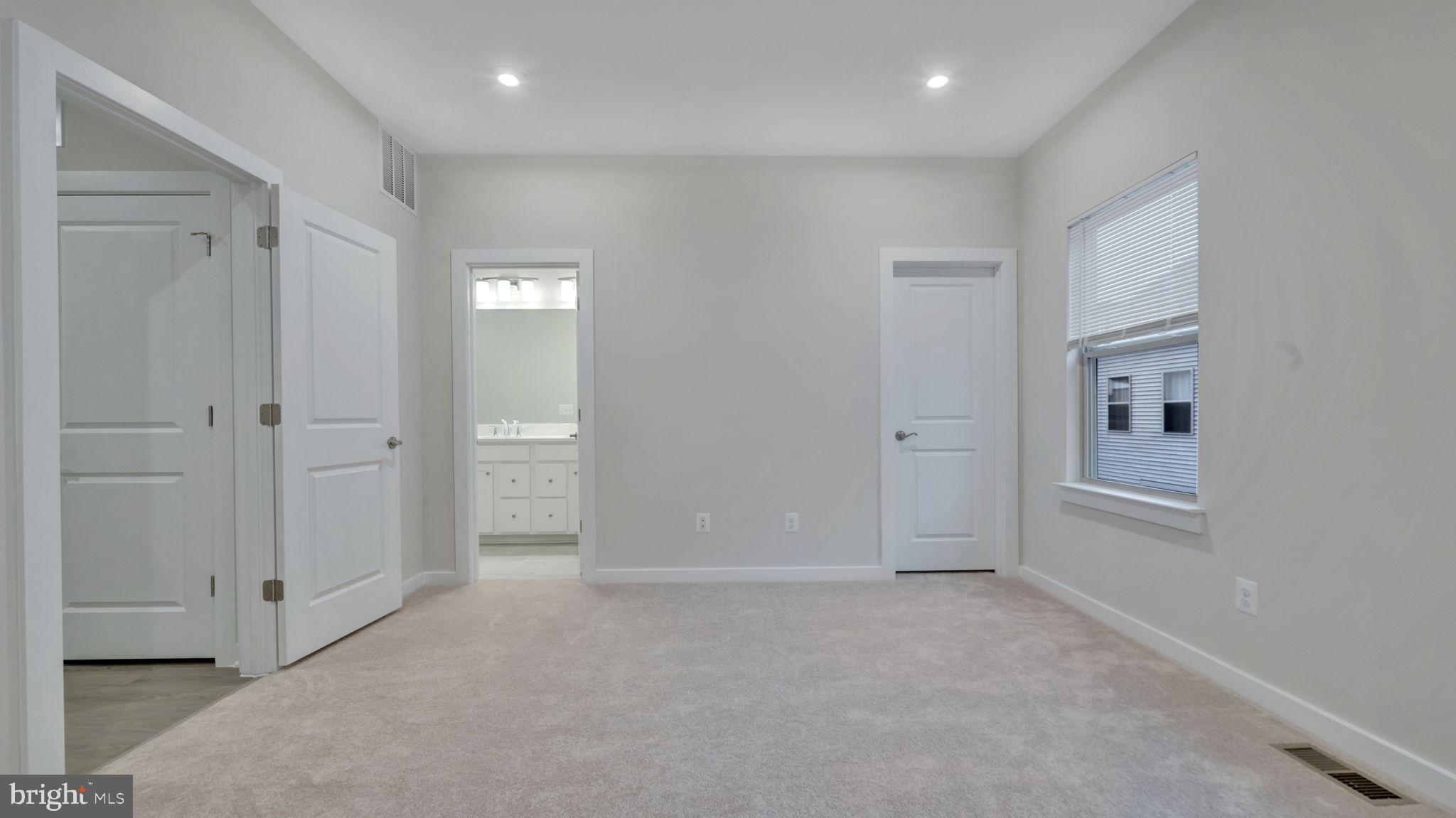 13170 Arches Road Herndon, VA 20170 - Photo 9 of 30 an empty room with closet and windows