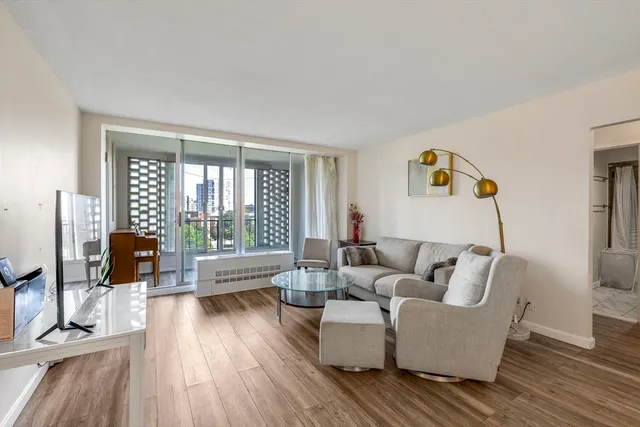 a living room with furniture and a large window