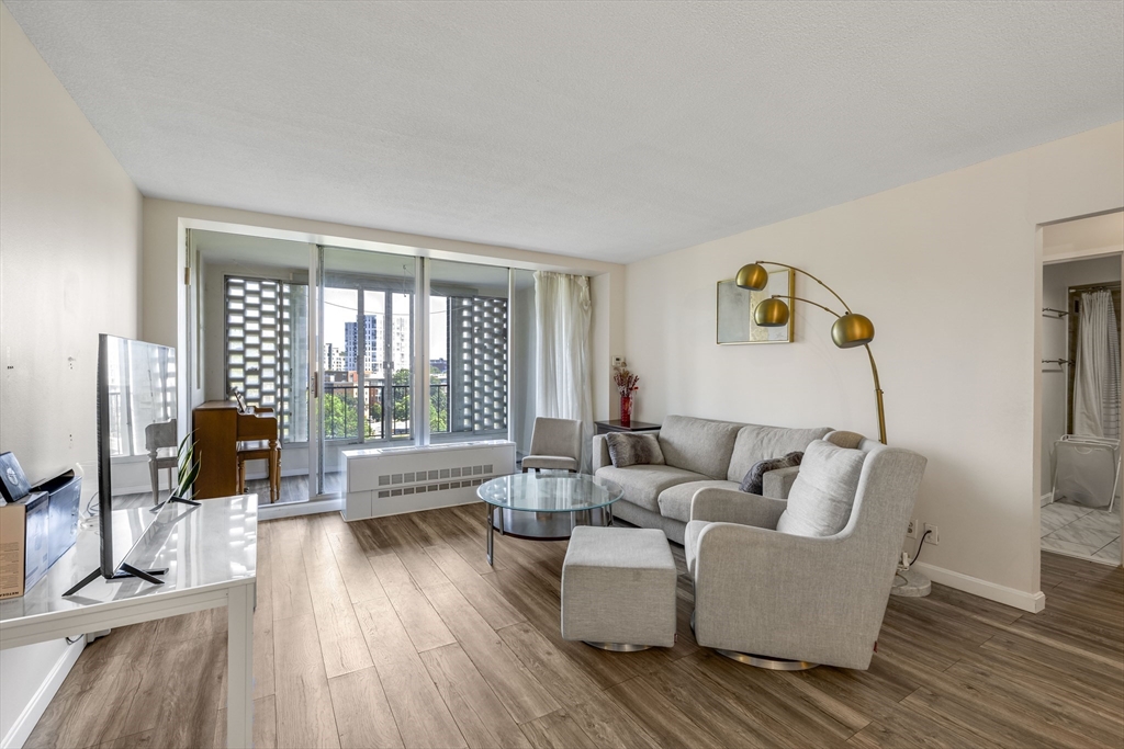 a living room with furniture and a large window