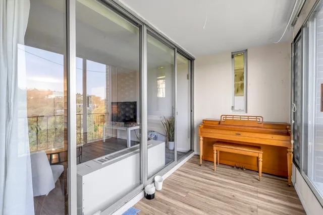 a bedroom with a bed and a chair