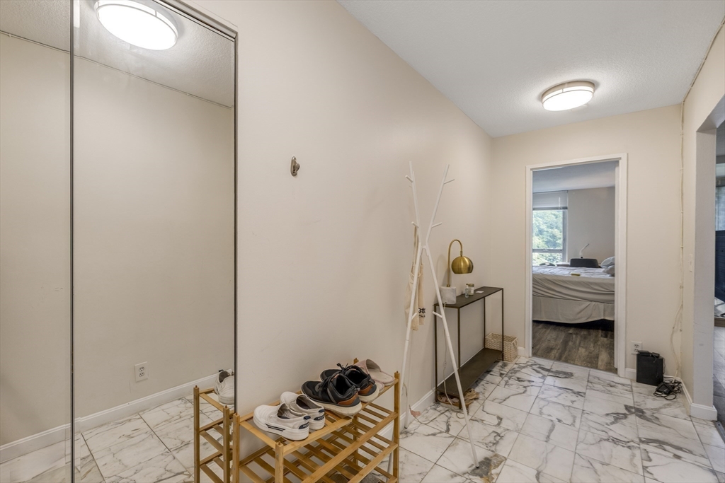 33 Pond Avenue, Unit 919 Brookline, MA 02445 - Photo 5 of 37 a view of a livingroom with furniture and a livingroom