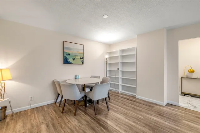 a kitchen with stainless steel appliances a sink stove and cabinets
