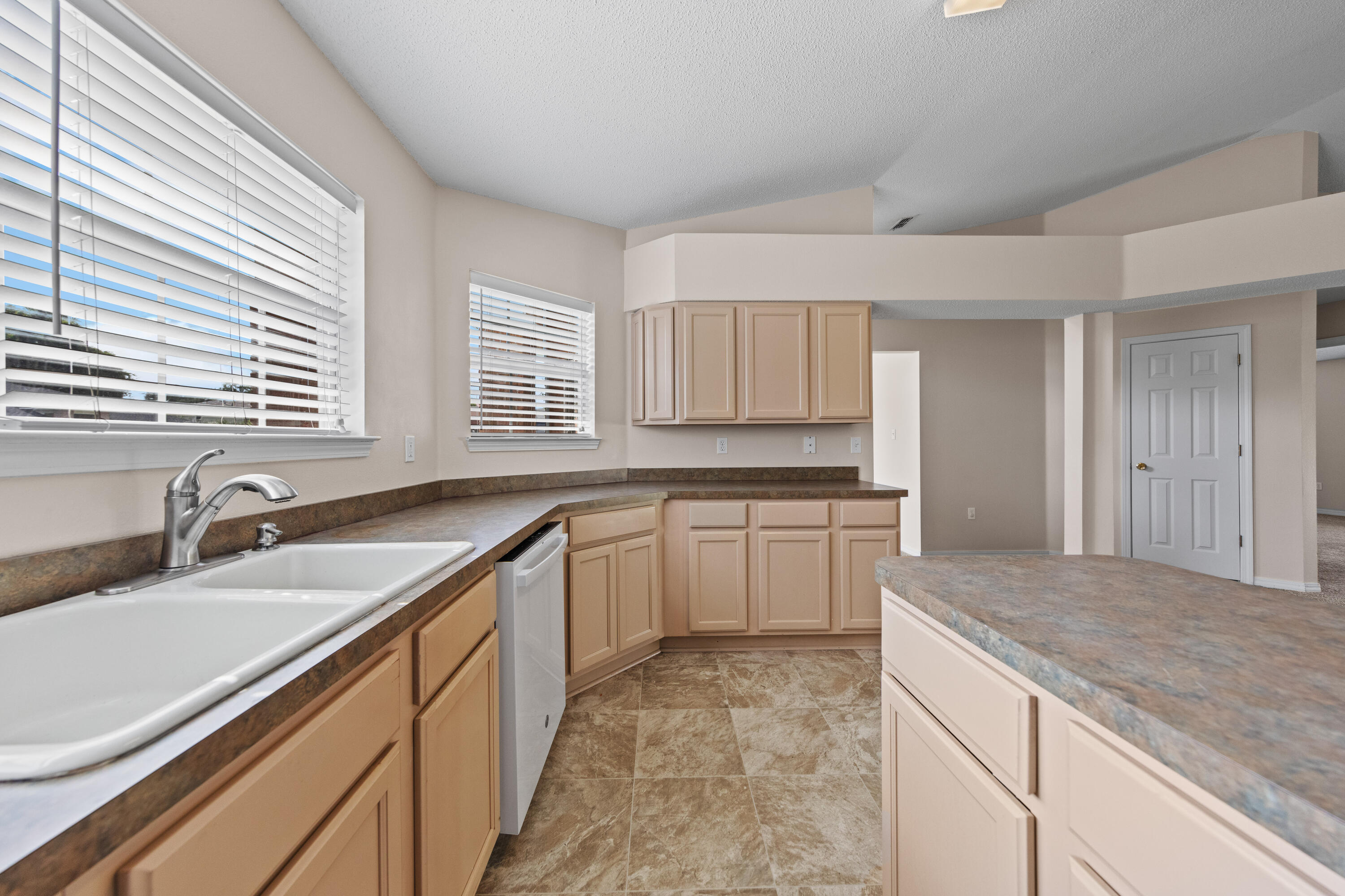 275 Limestone Circle Crestview, FL 32539 - Photo 11 of 45 a kitchen with a sink stove and cabinets