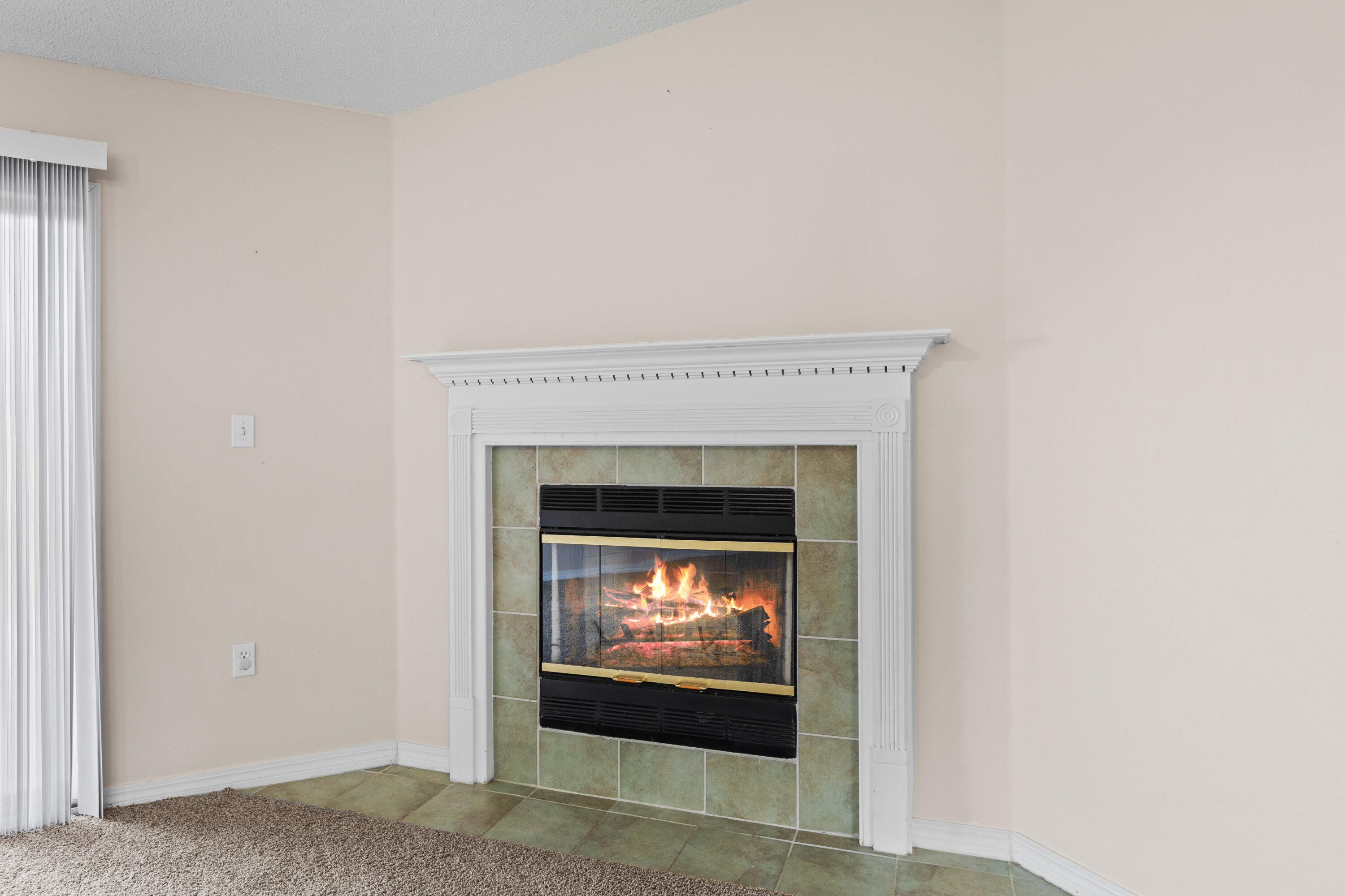 275 Limestone Circle Crestview, FL 32539 - Photo 17 of 45 a living room with a fireplace