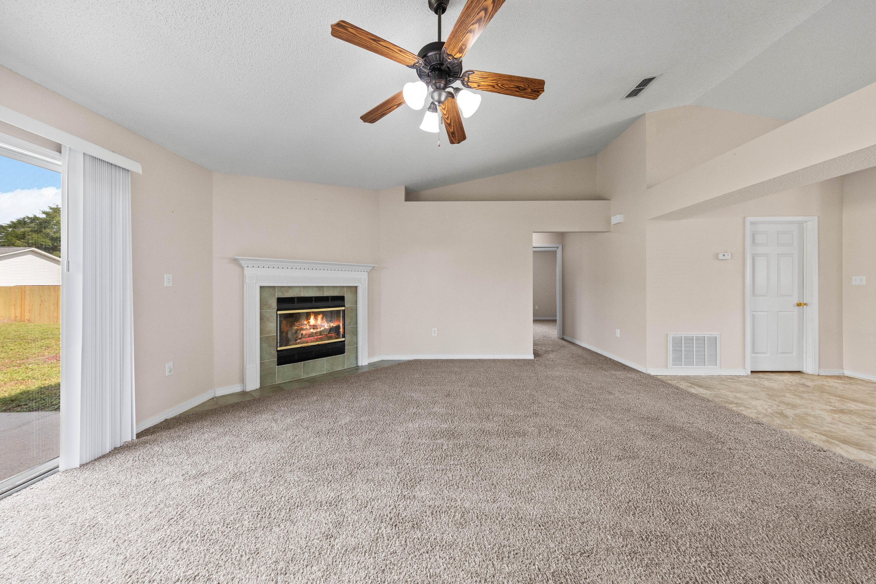 275 Limestone Circle Crestview, FL 32539 - Photo 21 of 45 a view of a livingroom with a ceiling fan and window