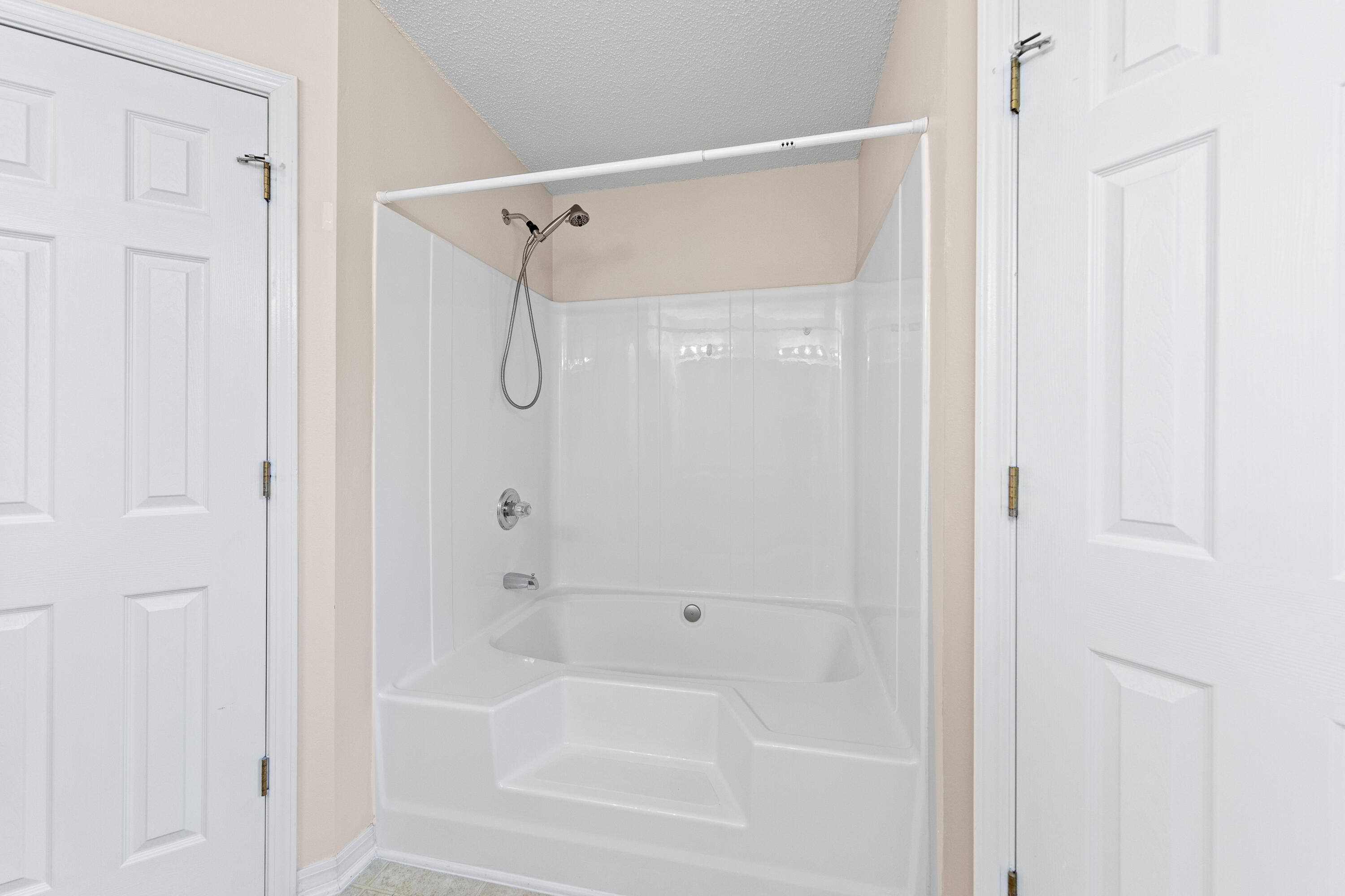 275 Limestone Circle Crestview, FL 32539 - Photo 35 of 45 a bathroom with a shower and a bath tub